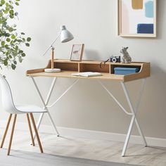 a wooden desk with a white chair next to it