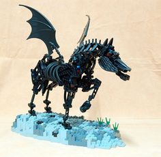 a lego model of a black dragon with wings