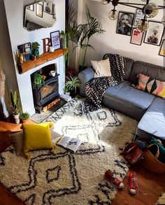 a living room filled with furniture and a fire place