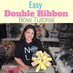 a woman sitting at a table with a bow in front of her and text overlay that reads easy double ribbon bow tutor