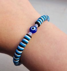 Evil eye clay bead bracelet for protection. Clay Bead Bracelet Ideas With Evil Eye, Evil Eye Bracelet Meaning, Evil Eye Clay Bead Bracelet, Evil Eye Clay, Eye Clay, Evil Eye Jewelry Bracelet, Evil Eye Beaded Bracelet, Clay Bead Bracelet, Bracelets With Meaning