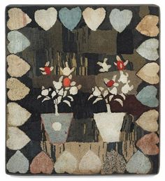 a rug with flowers and hearts on it