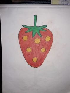 a drawing of a strawberry on a piece of paper