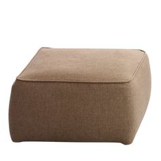 a brown ottoman sitting on top of a white floor