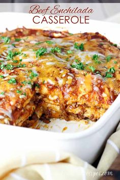 a casserole dish with meat, cheese and parsley