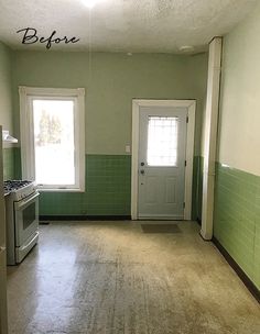 an empty kitchen with green tile and white appliances