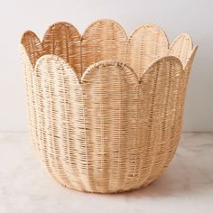 a wicker basket sitting on top of a white counter