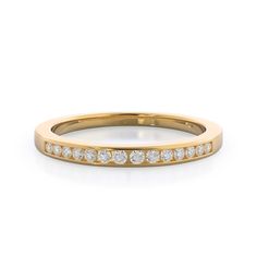 a yellow gold wedding band with rows of diamonds