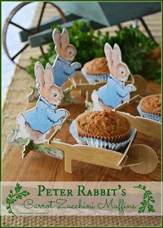 peter rabbit's carrot zucchini muffins on a wooden tray