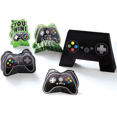 an assortment of video game themed items are displayed on a white surface with the words you win next to them