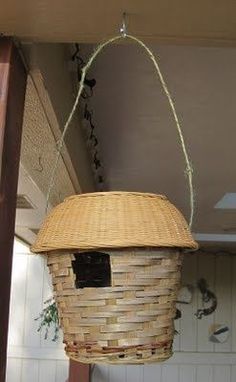 a bird house hanging from the ceiling