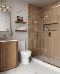 a bathroom with a toilet, sink, and shower stall in the middle of it