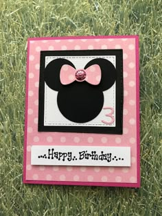 a minnie mouse birthday card on the grass