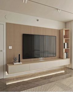 a living room with a large flat screen tv mounted on the side of it's wall