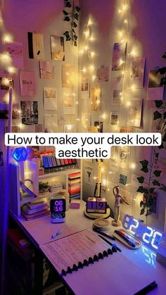 a computer desk with some lights on the wall and a clock in front of it