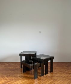 three tables sitting on top of a hard wood floor