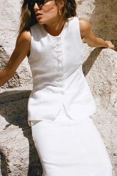 Softly tailored in 100% linen, the Domenico Vest Top in White is a feminine, vintage-inspired silhouette featuring a high round neckline, button front detail and an adjustable back strap to cinch at desired. Finished with a side pocket detail and fully lined for extra coverage. Linen Vest, Maxi Dress Sale, Dreamy Dress, Faithfull The Brand, Vest White, Vest Outfits, Top Collection, Linen Women, Vest Top