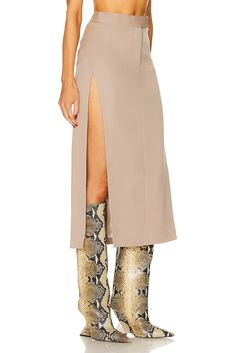 Find ATTICO Straight Midi Skirt on Editorialist. THE ATTICO Straight Midi Skirt in Beige Self: 100% virgin wool Lining: 53% acetate 47% viscose. Made in Italy. Dry clean only. Fully lined. Zip fly with hook and bar closure. ATTF-WQ76. 241WCS186 - W046 - 198. About the designer: Attico represents a time where glamour ruled and decadence was a way of life. Derived from the Italian word for penthouse, Attico is reviving the way a woman gets dressed. Launched in 2016, Italian designers Giorgia Tordi Fall Fitted Beige Maxi Skirt, Fitted Beige Maxi Skirt For Fall, Tailored Chic Wool Skirt, Tailored Wool Skirt Chic Style, Chic Tailored Wool Skirt, Chic Wool Mini Skirt, Chic Wool Midi Skirt, Spring Wool Midi Skirt, Fitted Wool Maxi Skirt For Fall