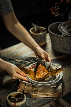 a person is cutting up some food on a plate