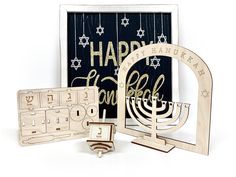 a hanukkah menorah set with the word happy hanukkah on it