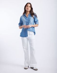 DESCRIPTION Elevate your everyday look with the Ava Vintage Shirt in Denim by White & Co. This essential Spring wardrobe staple offers a relaxed fit and a vintage wash, giving you that effortless yet stylish look. The soft, lightweight blue denim pairs perfectly with its button-down front, chest pocket, and subtle fading for a lived-in look. Team this shirt with your favourite white jeans for a fresh, on-trend outfit. Whether you're grabbing brunch with friends or jetting off on a holiday, the A Oversized Cotton Denim Button-up Top, Vintage Denim Button-up Top In Relaxed Fit, Relaxed Fit Washed Blue Button-up Denim Top, Cotton Denim Top With Frayed Hem And Button-up, Washed Blue Chambray Button-up Denim Top, Spring Wardrobe, Denim Shirt, Vintage Denim, Vintage Shirts