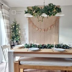 the table is set with plates and place settings for two people to sit at it