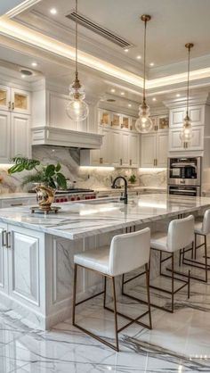 a large kitchen with marble floors and white cabinets