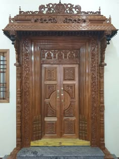 an ornate wooden door with carvings on it