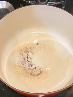 a frying pan filled with food on top of a stove