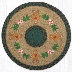 a round rug with christmas decorations on it