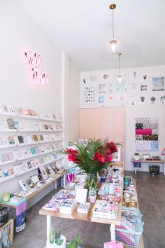 the inside of a craft shop with lots of items