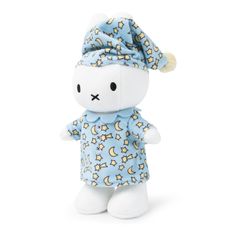 a small stuffed animal with a blue dress and hat on it's head,