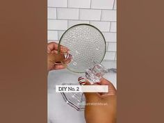 someone is holding a clear glass plate in their hand with the words diy no 2 on it