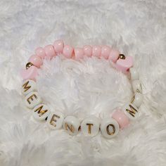 A whimsical yet solemn addition to your daily outfit! Pink pony beads and white alphabet beads make this bracelet the perfect accessory to wear this autumn season and everyday as a gentle reminder to savor every day! Two pink heart shaped beads accent the words in this easy to wear bracelet.  Bracelet is about 7 inches diameter.  Sized to fit most. Pony Bead Bracelets, Pink Planner, Whimsical Jewelry, Bracelet Heart, Alphabet Beads, Outfit Pink, Autumn Season, Pony Beads