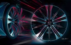 the wheels of a car are shown in this artistic photo, with bright lights coming from them