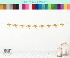 a wall decal with gold foiled kangaroos on it and the words fully assembled