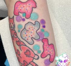 a person with colorful paint on their arm and leg, has a giraffe design painted on it