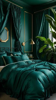 a bedroom with green walls, curtains and a bed covered in teal comforter