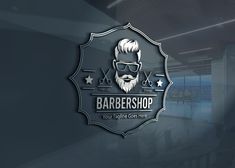 a barber shop logo on a wall