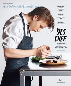 a man in an apron is cutting food on a plate with a knife and fork