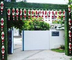 a gate decorated with red and white decorations