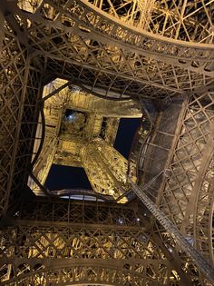 looking up at the top of the eiffel tower