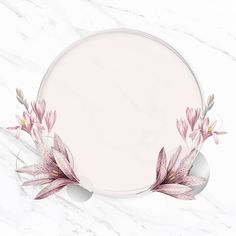 a round frame with pink flowers on a white marble background and an empty space for the text