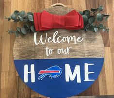 a welcome to our buffalo home sign with a bow on it's head and the words, welcome to our buffalo home