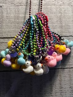 a bunch of beads hanging from a hook