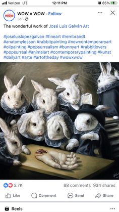 an image of some white rabbits in front of a painting with the caption,