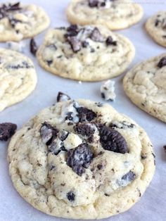 chocolate chip cookies are arranged on a baking sheet