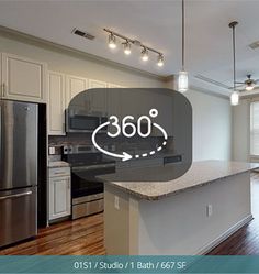 a kitchen with stainless steel appliances and an advertisement for 360 on the wall above it