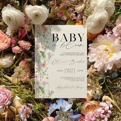 a baby is born sign surrounded by flowers