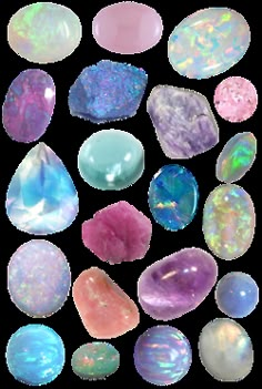 many different colored rocks and stones on a pink background